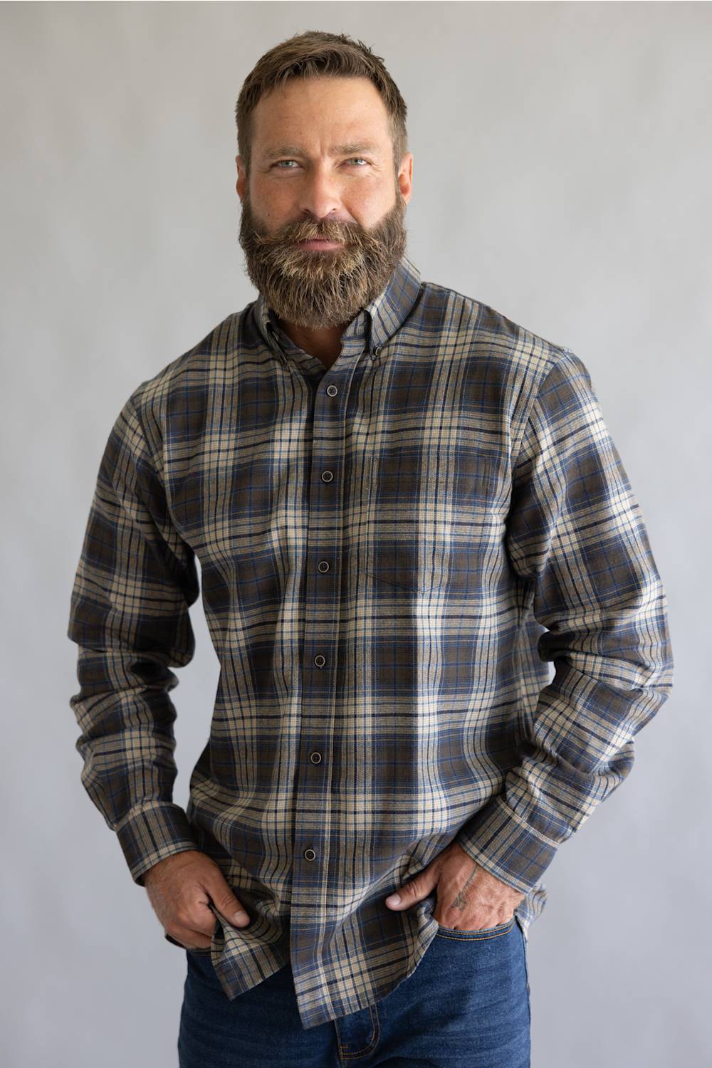 Brown and blue button down flannel shirt with long sleeves