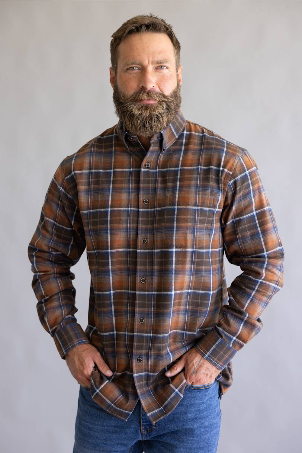 Orange and blue flannel patten, on a button down and long sleeve 