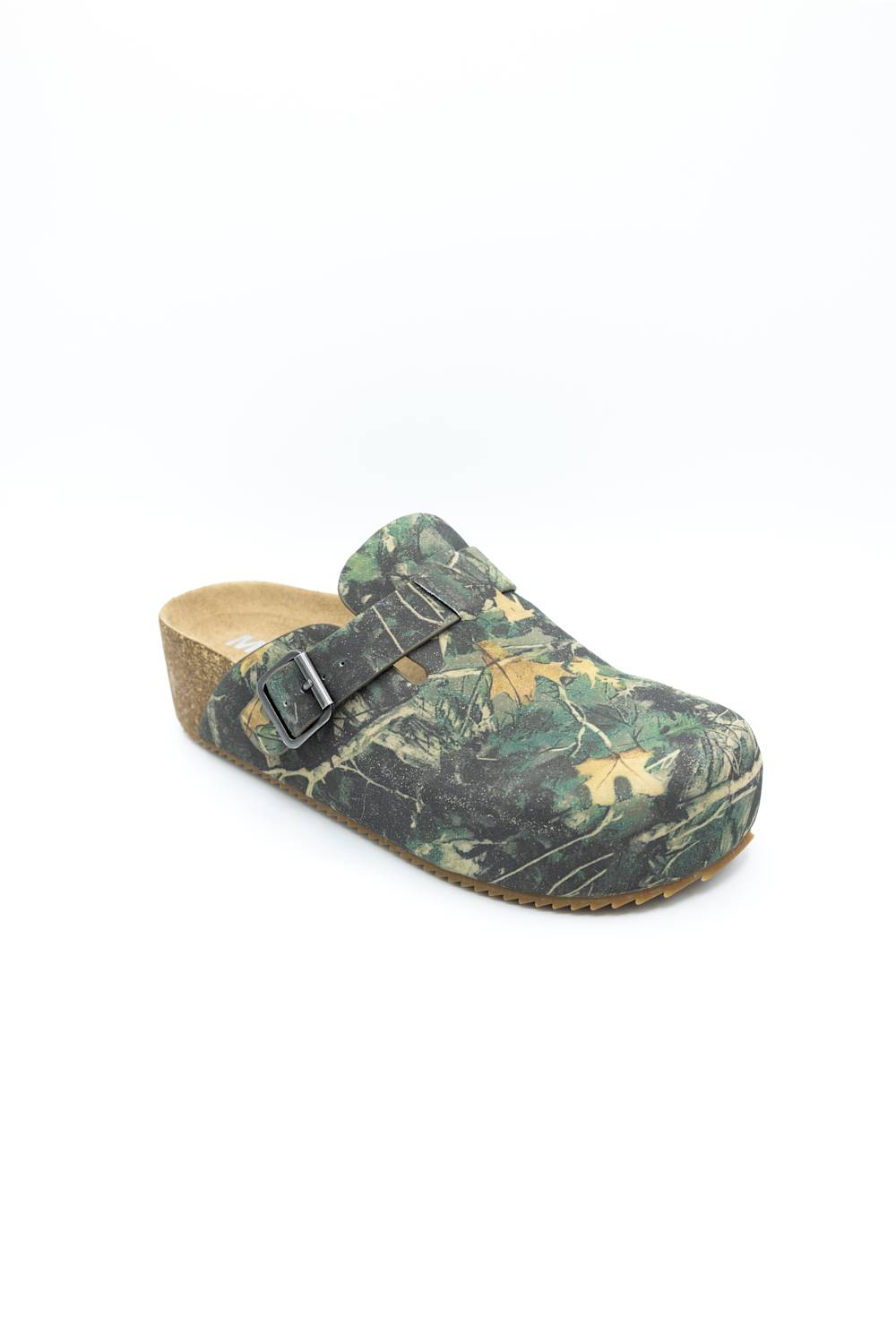 A single clog-style mule shoe with a green and brown woodland camouflage pattern, featuring two dark metal buckles on the strap and a cork wedge heel, shown against a plain white background.