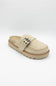 A single beige slip-on clog-style shoe with a braided strap detail and a silver-tone buckle, shown on a light gray background.