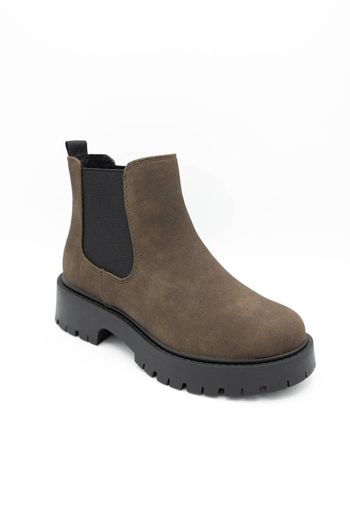 A single brown suede Chelsea boot with black elastic side panels and a chunky black lug sole, shown from a three-quarters angle on a white background.
