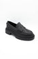 Black dress shoes with textured details on a white background