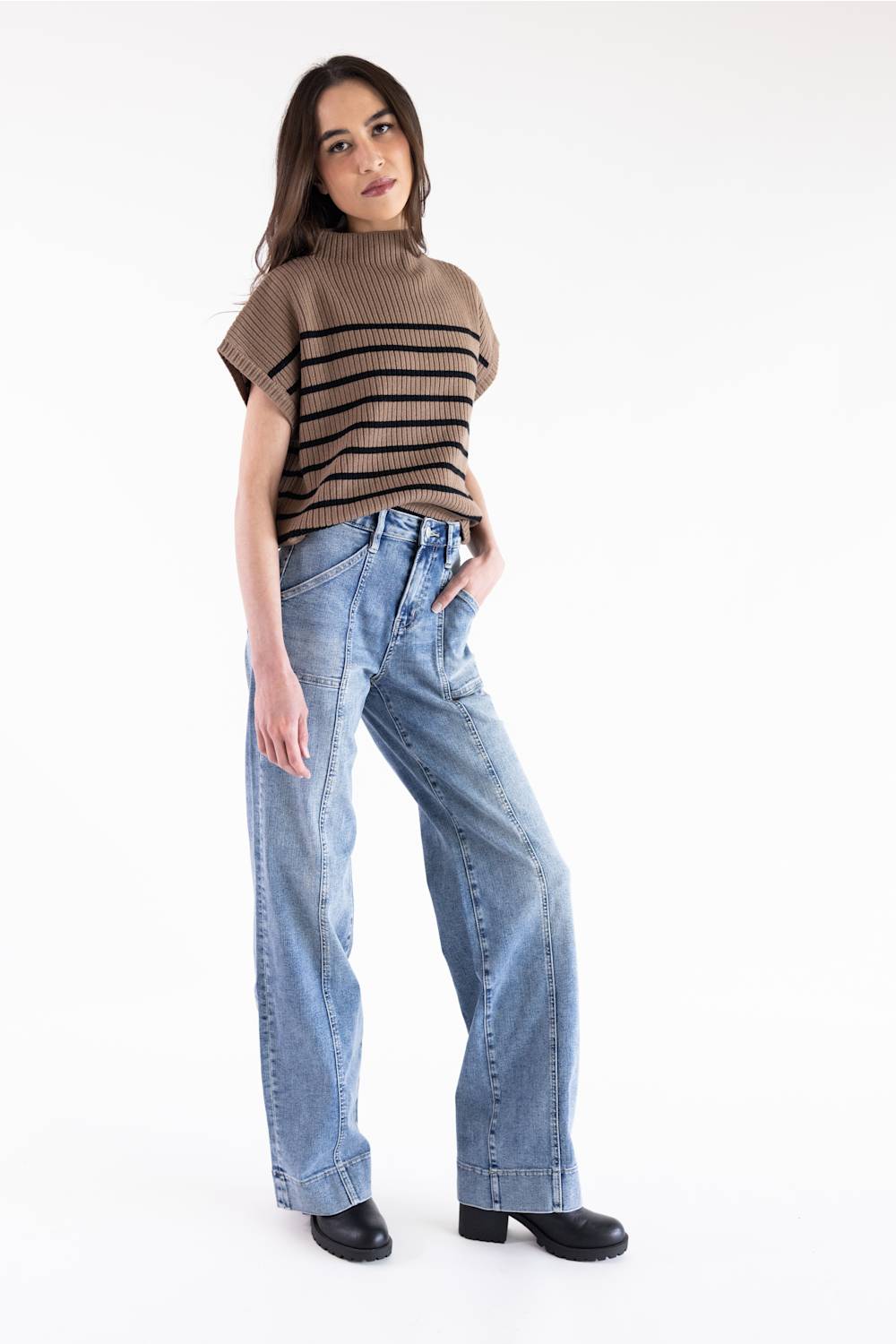 High-rise fit defining the waist with structured center seam detailing and unique pocket styling.