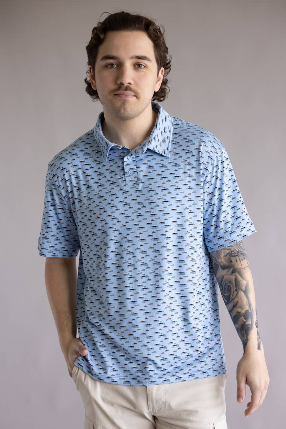 Hallstatt Pontoon Polo for Men in Blue; Man wearing a blue patterned polo shirt against a plain background