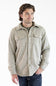 A man wearing a snap up Hallstatt Sherpa Lined Shacket for Men in Oatmeal Heather with two chest pockets.