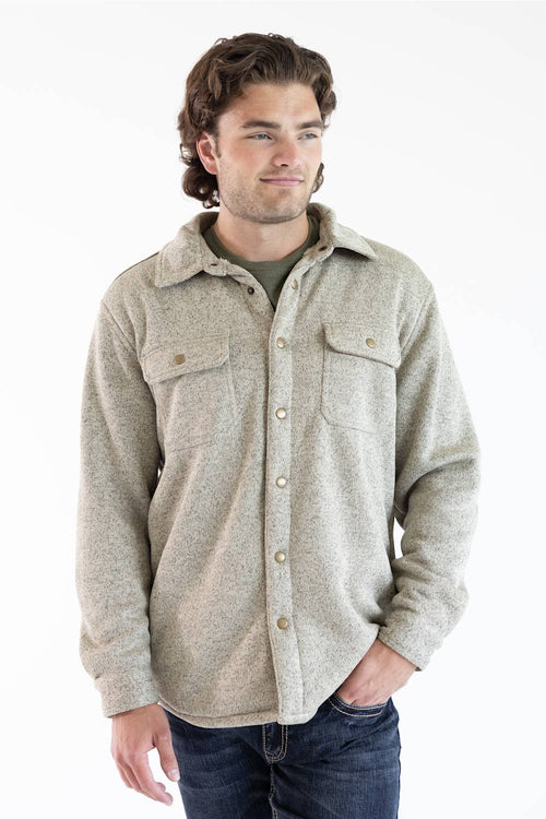 A man wearing a snap up Hallstatt Sherpa Lined Shacket for Men in Oatmeal Heather with two chest pockets.