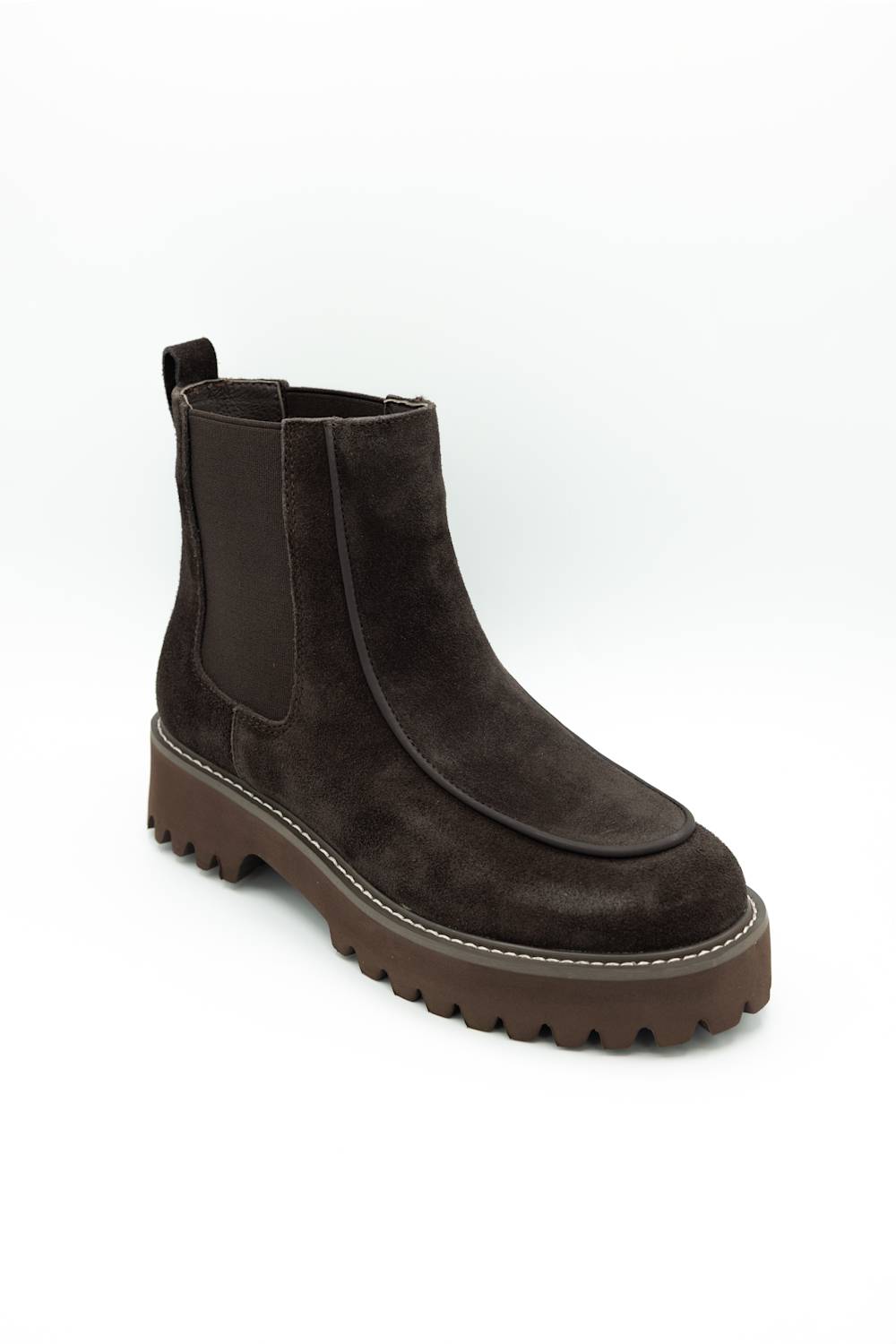 A dark brown suede Chelsea boot with a chunky lug sole, photographed on a clean white background.