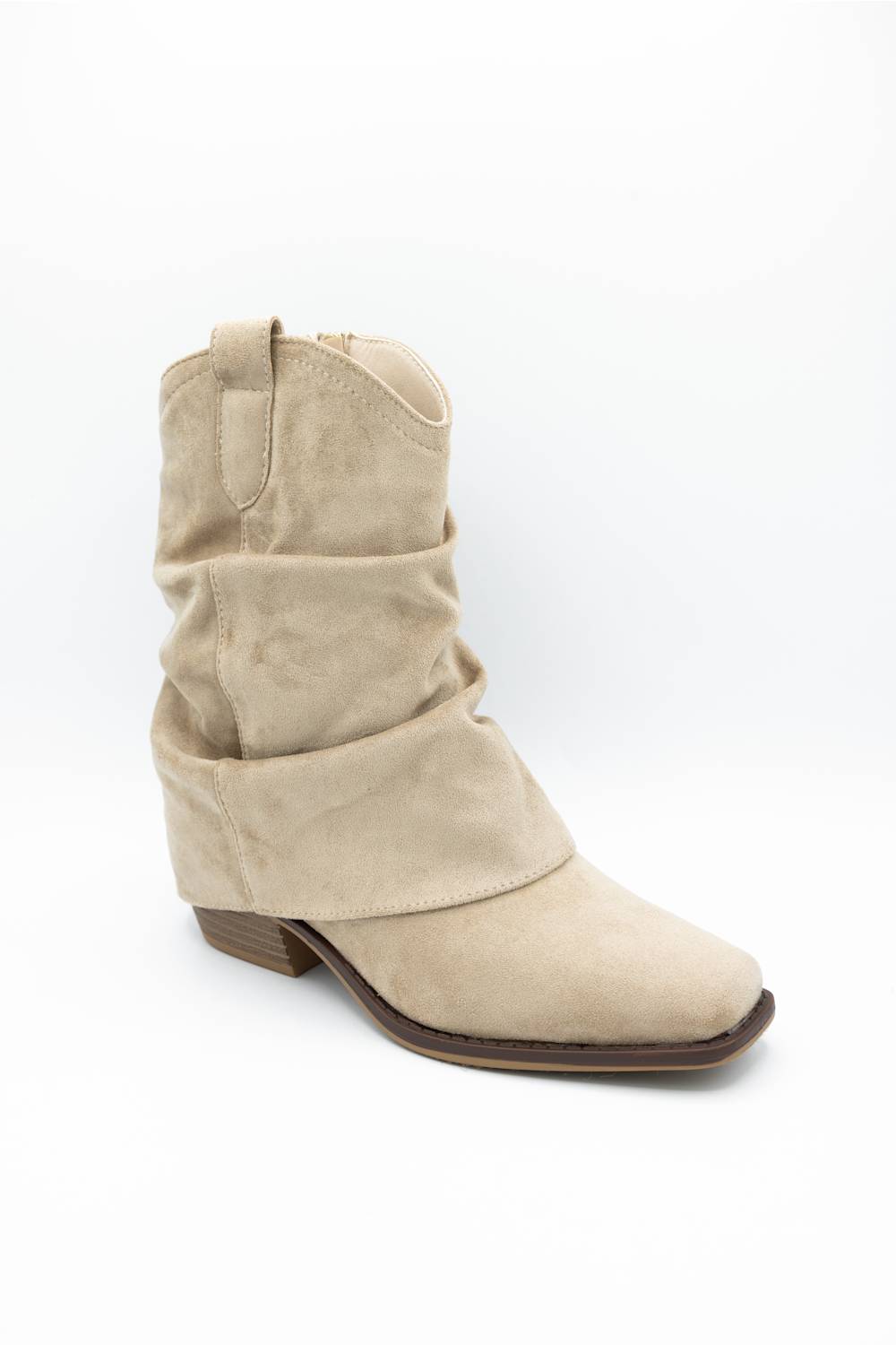 A single beige suede slouchy ankle boot with a low brown block heel, shown from a side profile on a white background.