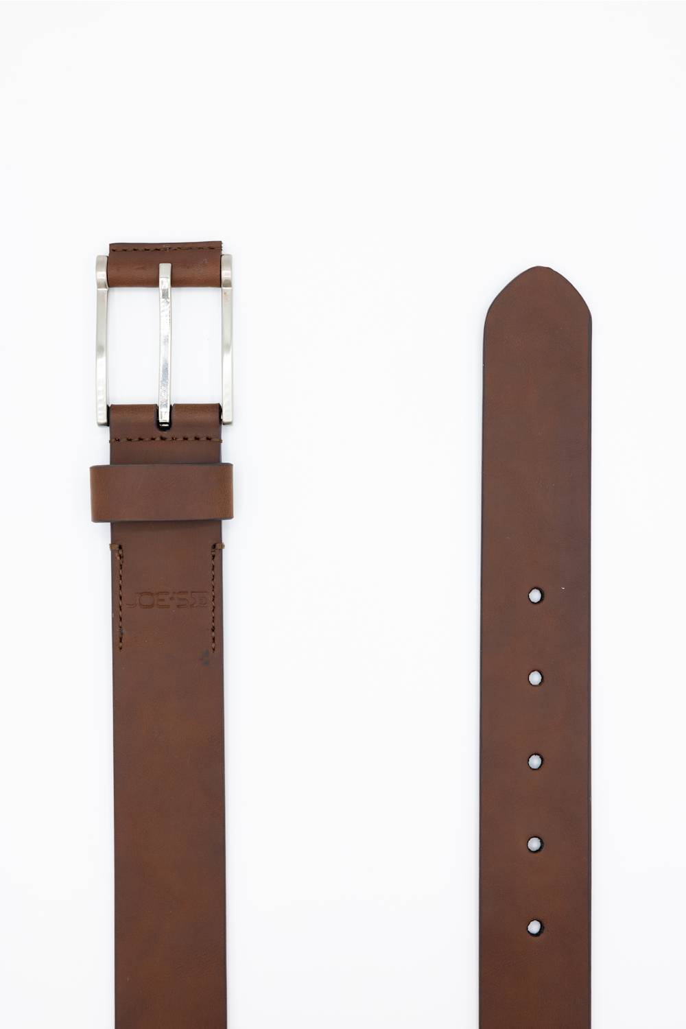 A brown leather belt shown flat on a white background, with the buckle side on the left and the strap end on the right. The buckle is silver-toned metal, and the leather is a medium warm brown.