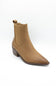 A tan suede ankle boot with a pointed toe, elastic side gore, and a low stacked heel, shown on a white background.