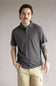 Kuhl De Facto Polo Shirt for Men in Carbon; Man wearing a gray polo shirt and beige pants against a plain background