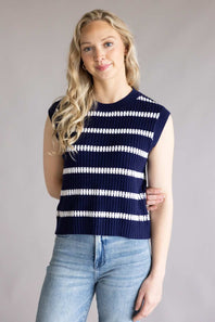 Woman wearing the La Miel Crochet Stripe Top for Women in Galaxy which is a navy blue and white striped sleeveless sweater against a plain background