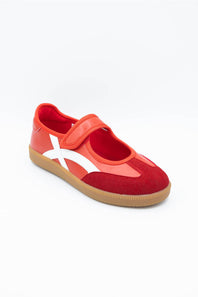 A red  shoe with a white diagonal stripe and a tan sole, photographed on a clean white background.