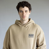 Marsh Wear Badge Hoodie for Men in Sandstone