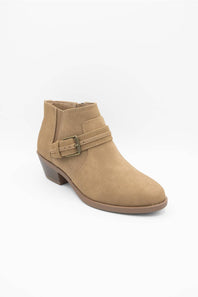 A tan suede ankle boot with a low block heel and a decorative strap across the instep with a metal buckle, shown on a plain white background.