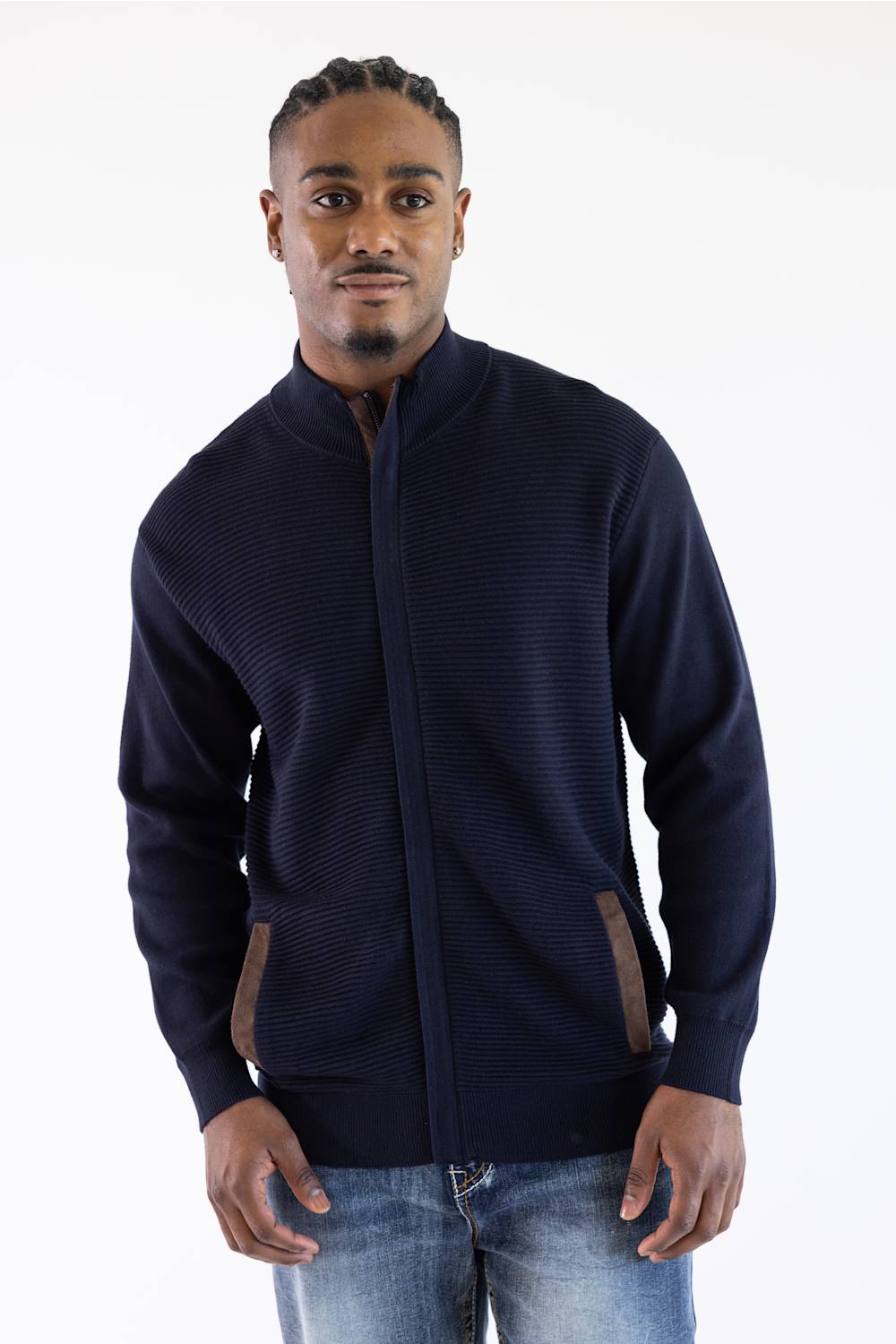 Man wearing a navy mock neck jacket standing against a white background