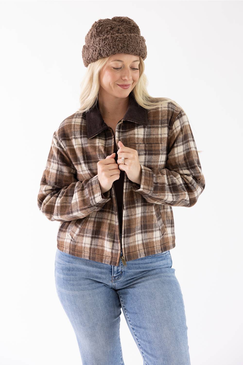 Model wearing the Brown and Cream Plaid Barn Jacket with a dark brown corduroy collar, brown beanie, and blue jeans, standing against a neutral background.