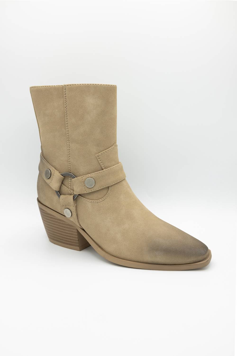 A single beige suede ankle boot with a pointed toe, stacked block heel, and a decorative strap detail with silver-tone studs on the side, shown against a plain white background.