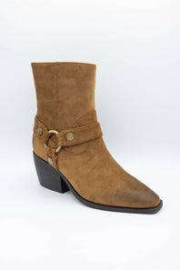 A single brown suede ankle boot with a pointed toe, black block heel, and a decorative strap with brass-tone studs and a ring detail on the side, shown against a plain white background.