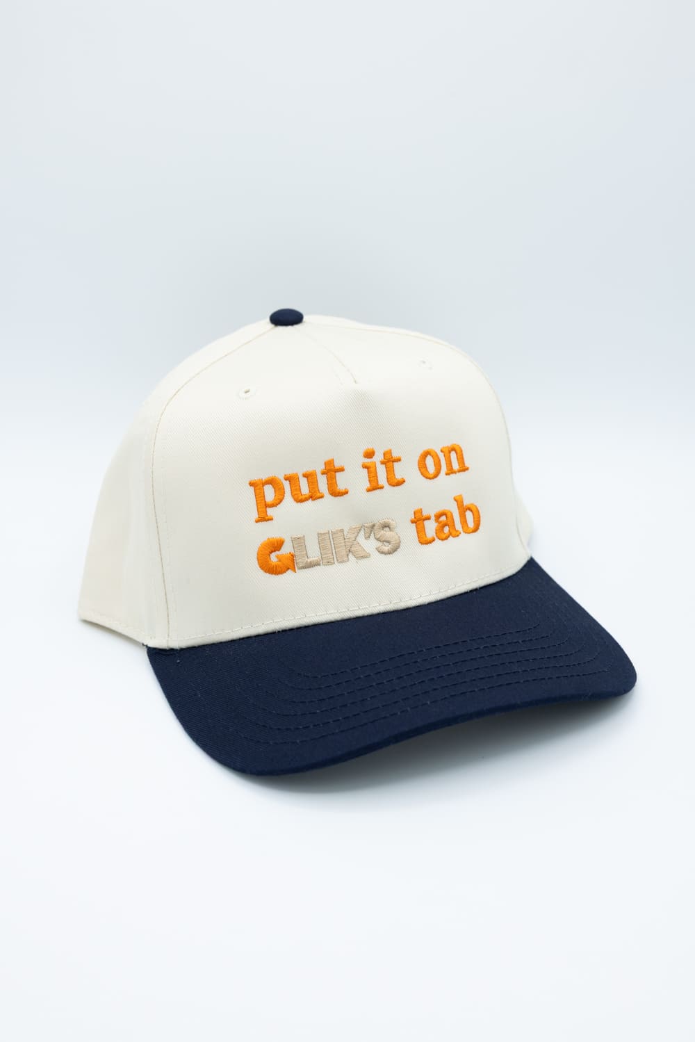 Put It On Glik's Tab Trucker Hat for Women in Navy/Tan
