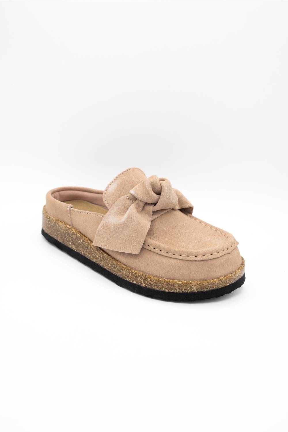 A single slip-on mule shoe in blush suede with a matching fabric bow on the vamp and a cork-textured midsole, shown against a plain white background.