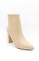 A single beige ankle boot with a pointed toe and a chunky block heel, photographed on a clean white background.