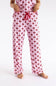 Pink pajama pants with a red bow and vertical stripe pattern, featuring a red drawstring waist, modeled on a person against a white studio background.