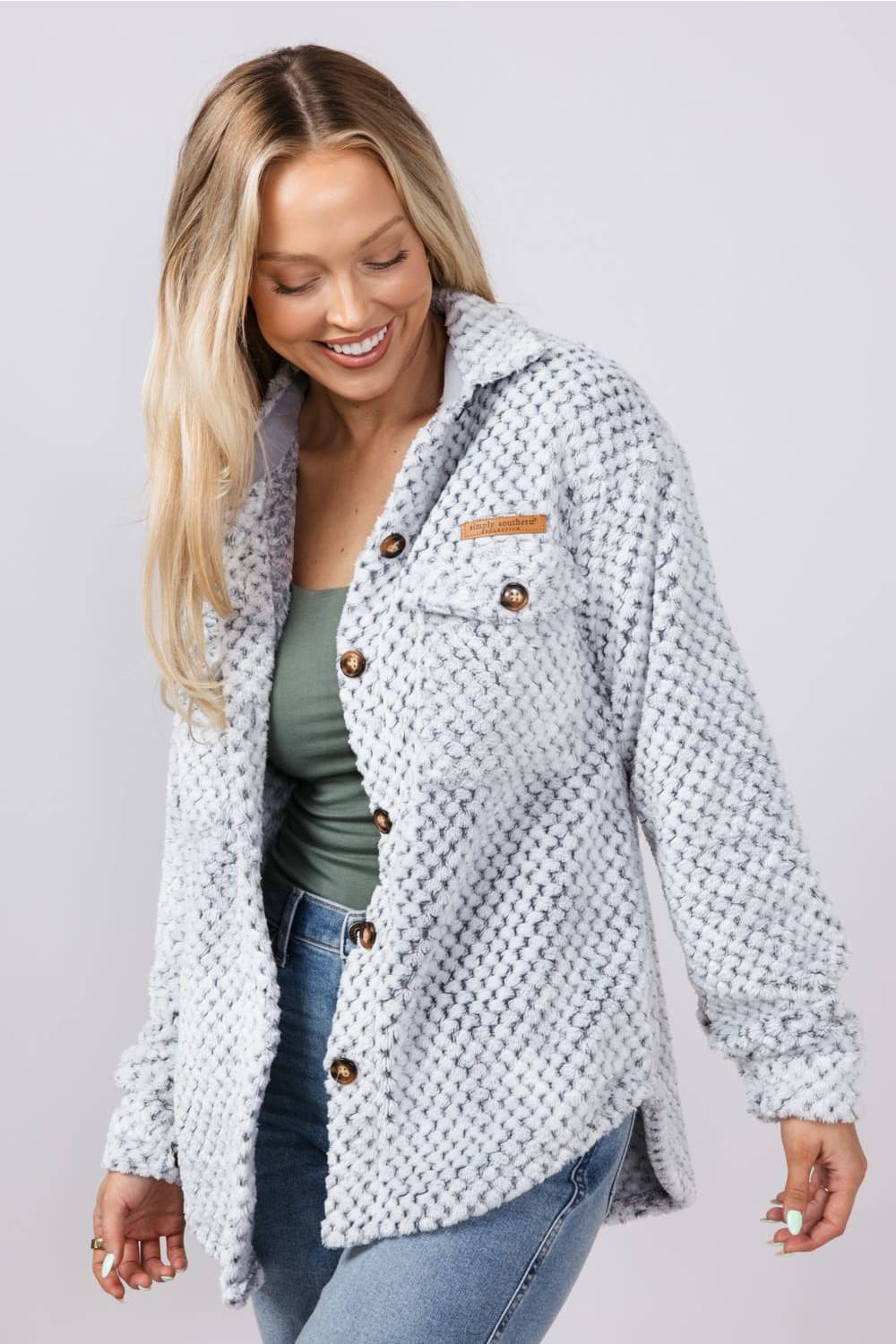 Soft fleece button up shacket with cuffs, and tortoiseshell buttons and chest pockets 