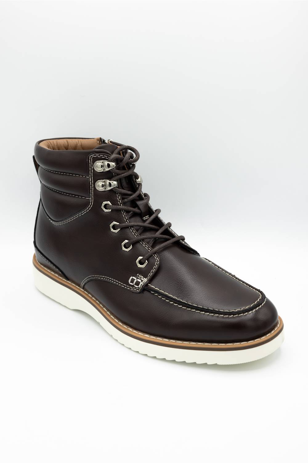 A dark brown leather lace-up ankle boot with silver metal eyelets, a tan midsole, and a white outsole, shown on a light gray background.
