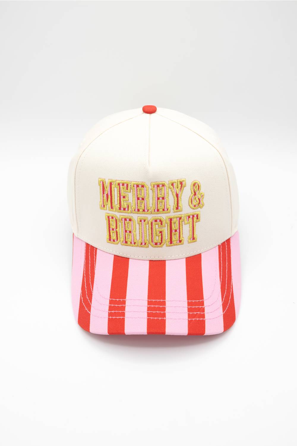 Front view of the Simply Southern Merry & Bright Holiday Hat in Cream/Stripe against a white background, featuring yellow and red striped embroidered lettering reading "MERRY & BRIGHT" on the cream front panel and a red and pink striped visor.