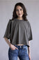 Simply Southern Washed Tee for Women in Grey; Woman wearing a gray oversized t-shirt and blue jeans against a plain background