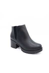 A single black leather ankle boot with a chunky block heel and a textured lug sole, shown from a three-quarters angle on a white background.