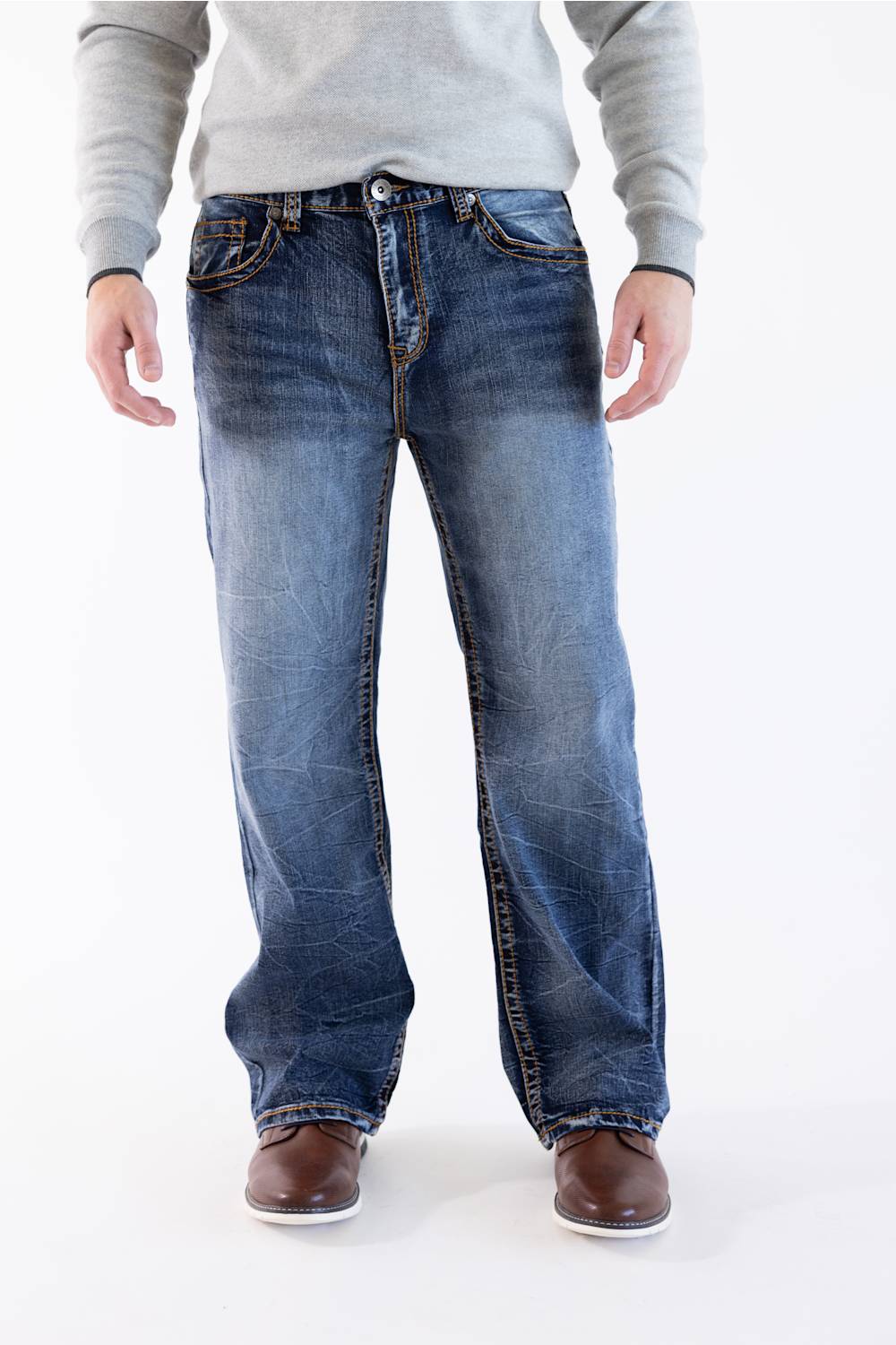 Men's True Luck Truman Loose Straight jeans in a dark wash, featuring a relaxed fit, whiskering at the hips, and subtle fading down the straight legs, styled with a gray sweater and brown shoes.