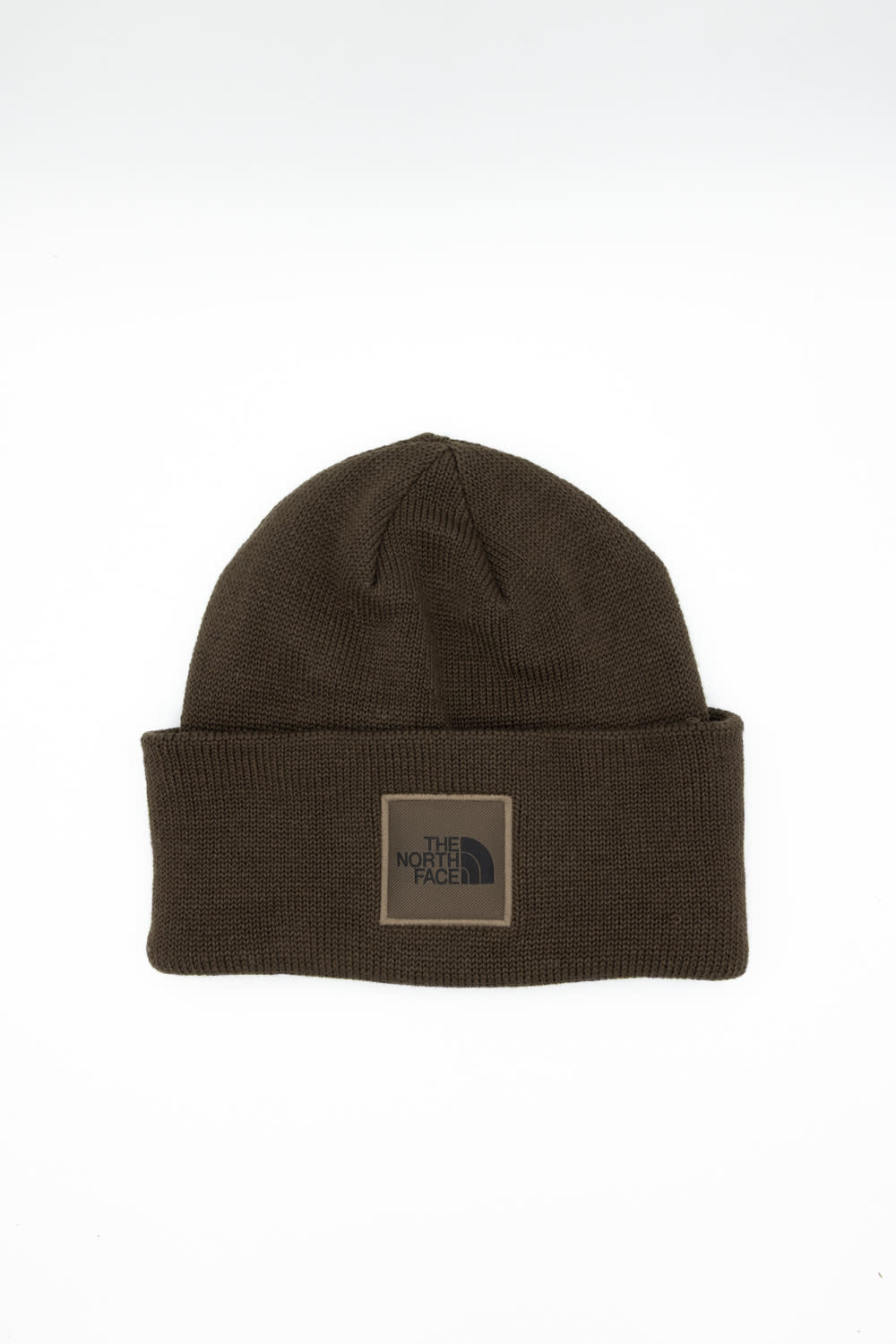 Front view of a dark chestnut brown ribbed knit beanie featuring a folded cuff hem with a square patch displaying The North Face logo against a plain white background.