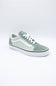 A classic low-top platform sneaker in sage green and white, featuring a thick white platform sole, white laces, and the signature side stripe.