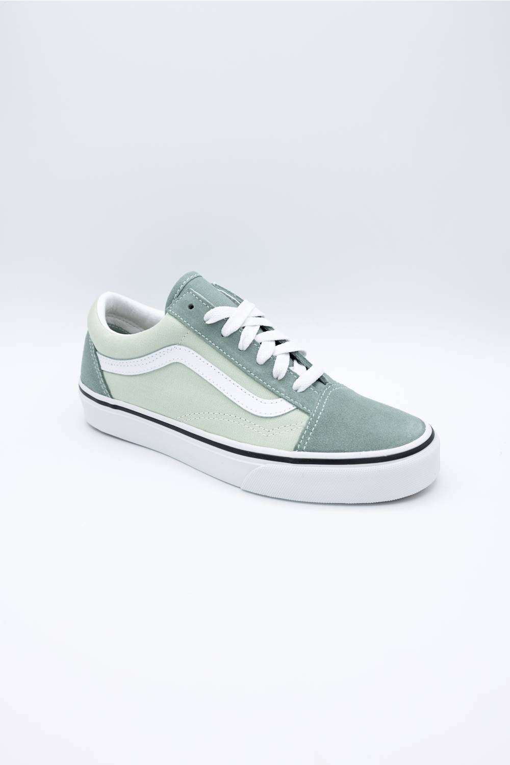 A classic low-top platform sneaker in sage green and white, featuring a thick white platform sole, white laces, and the signature side stripe.