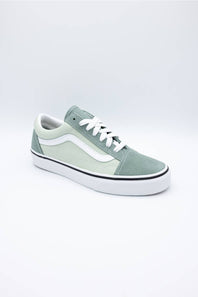 A classic low-top platform sneaker in sage green and white, featuring a thick white platform sole, white laces, and the signature side stripe.