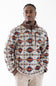 A man wearing a quarter-zip fleece pullover with a Southwestern geometric pattern in beige, blue, and rust red, paired with khaki pants, against a plain white background.