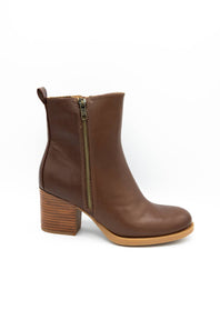 A single brown leather ankle boot with a chunky block heel and a black textured sole, shown from a side profile on a white background.