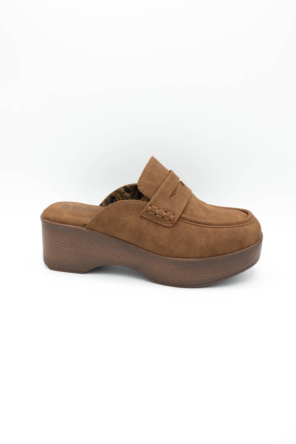 A single brown suede platform mule slipper with a decorative strap and stacked wedge heel, shown from a side profile on a white background.