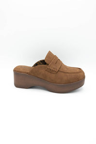 A single brown suede platform mule slipper with a decorative strap and stacked wedge heel, shown from a side profile on a white background.
