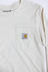 An off-white Carhartt long-sleeve pocket t-shirt, showing the chest pocket with the signature Carhartt logo patch.