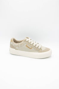 A low-top sneaker in beige and off-white, featuring a patterned fabric on the heel, white laces, and a thick white rubber sole, shown against a plain white background.