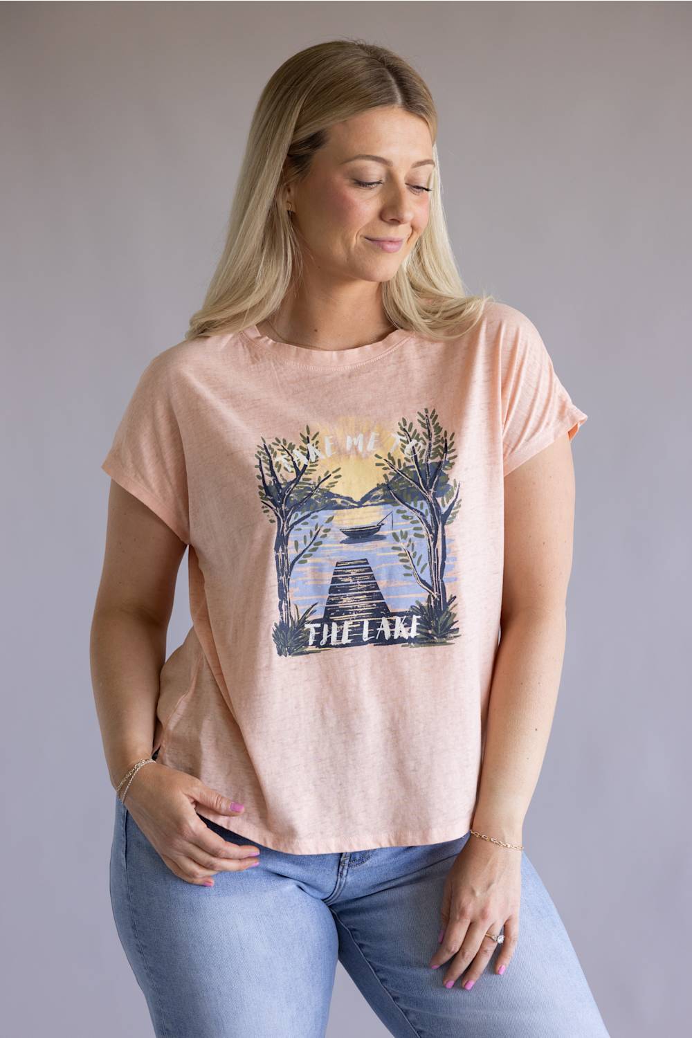 C&C California Lake Tee for Women in Pink; Woman wearing a pink t-shirt with a graphic design on a plain background