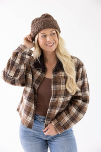 Blonde woman modeling a brown fur fisherman hat 