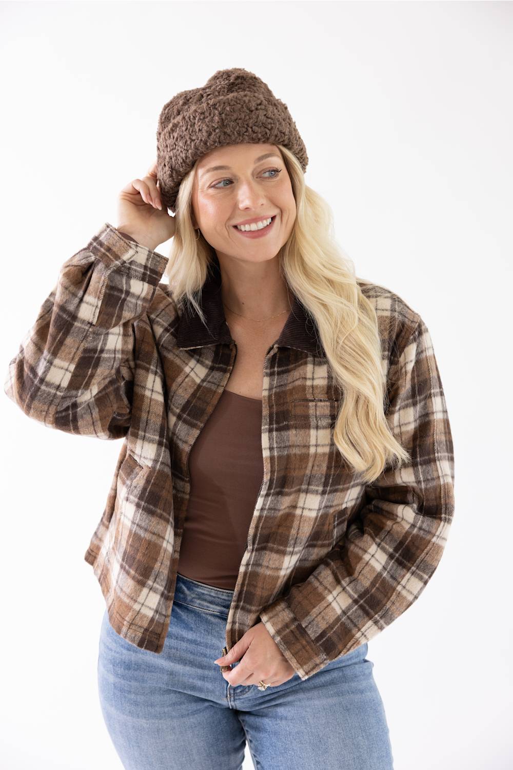 Blonde woman modeling a brown fur fisherman hat 
