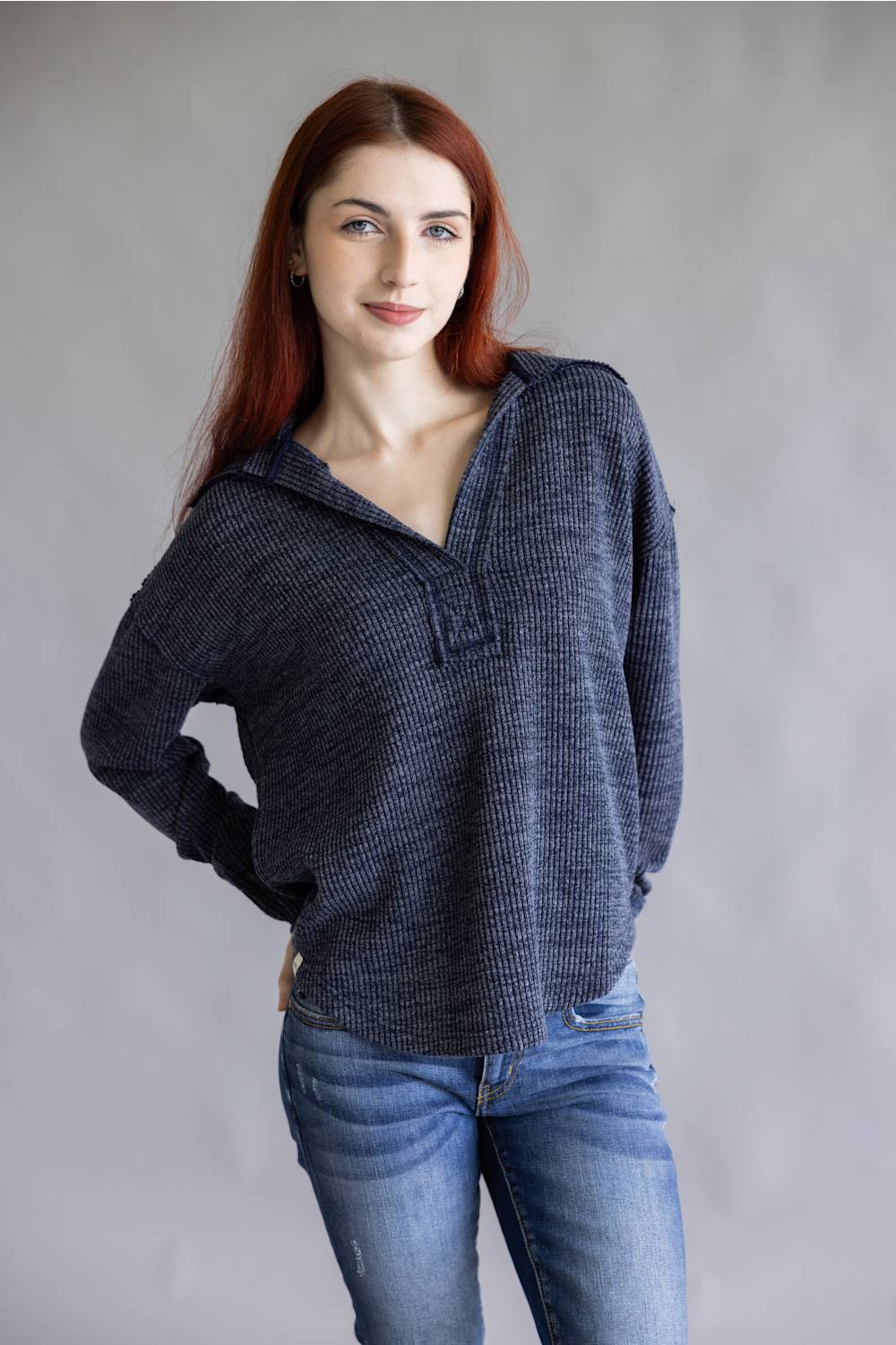 Ribbed v-neck sweater top with long sleeves and exposed seams