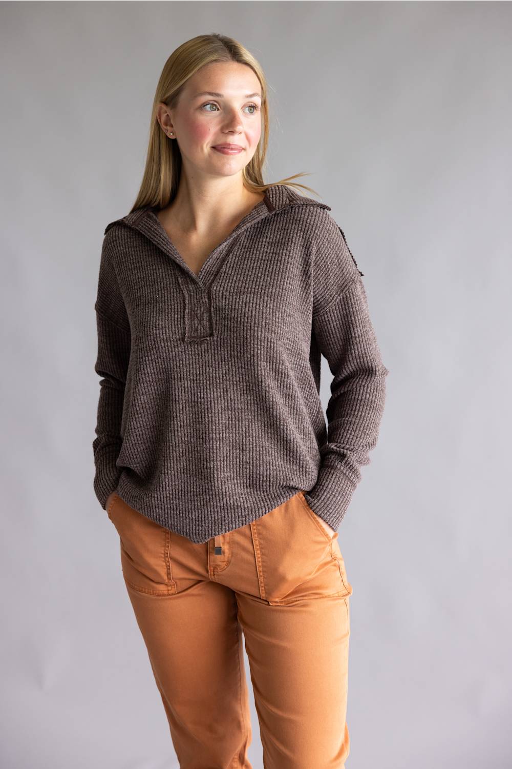 Long sleeve ribbed top in brown, with a deep collar v-neckline 