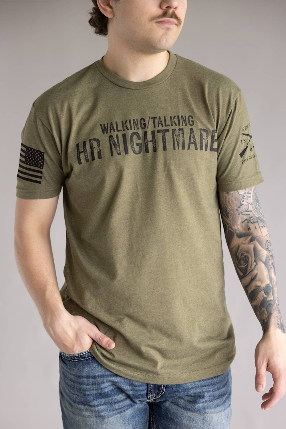Grunt Style 1776 HR Nightmare T-Shirt for Men in Green; Man wearing a green t-shirt with text and a flag design on a plain background