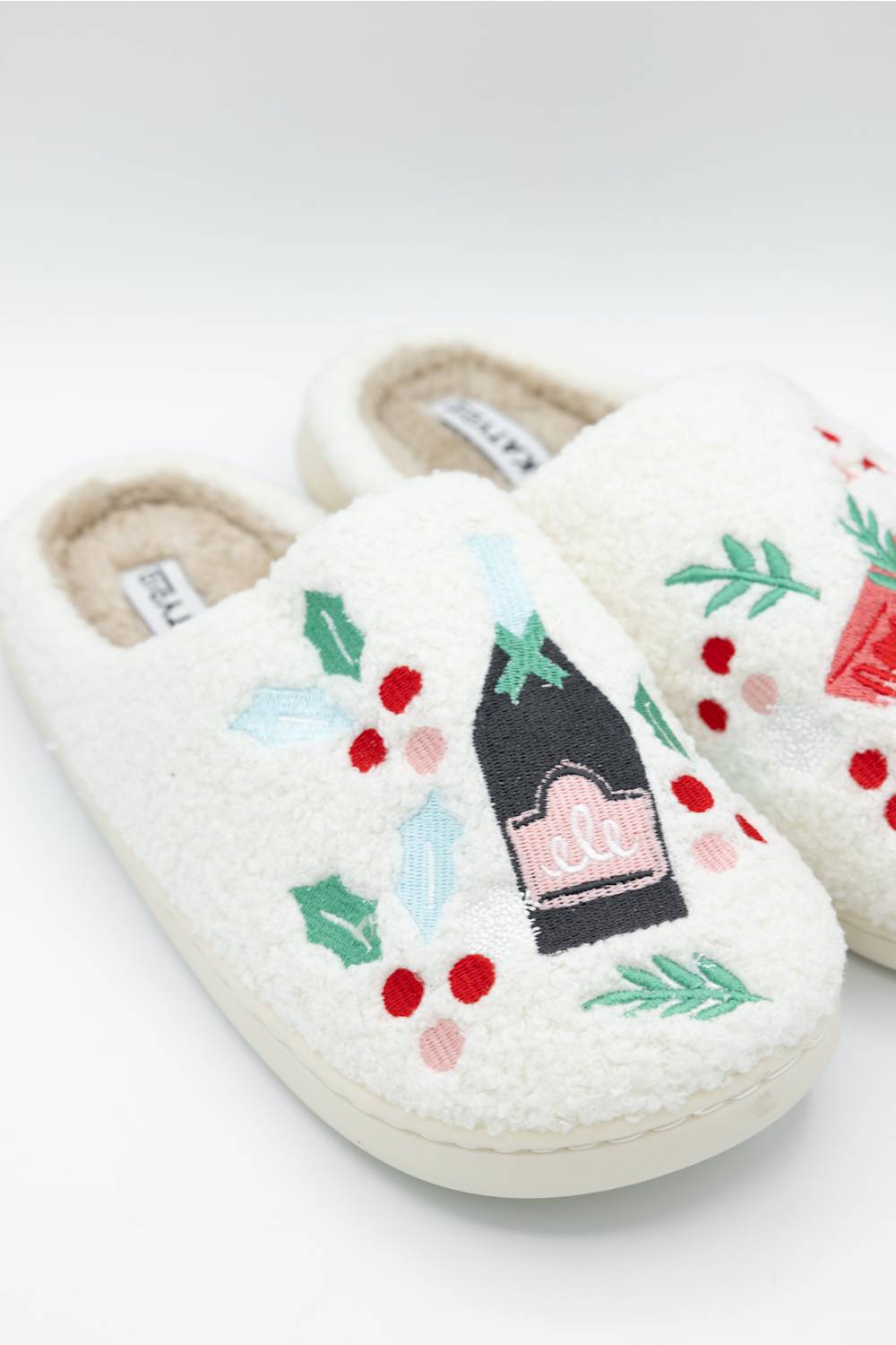  white slipper featuring festive holiday drinks 